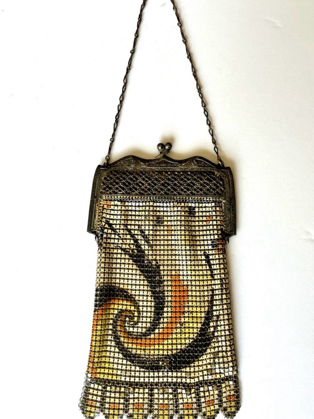 Art Nouveau enamel metal mesh evening bag with swirl design.